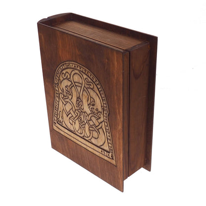Historical wooden box in the shape of a book with  runestone