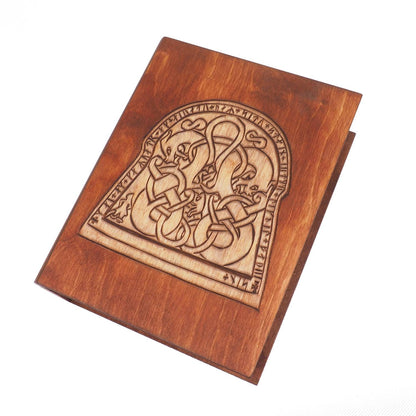 Historical wooden box in the shape of a book with  runestone