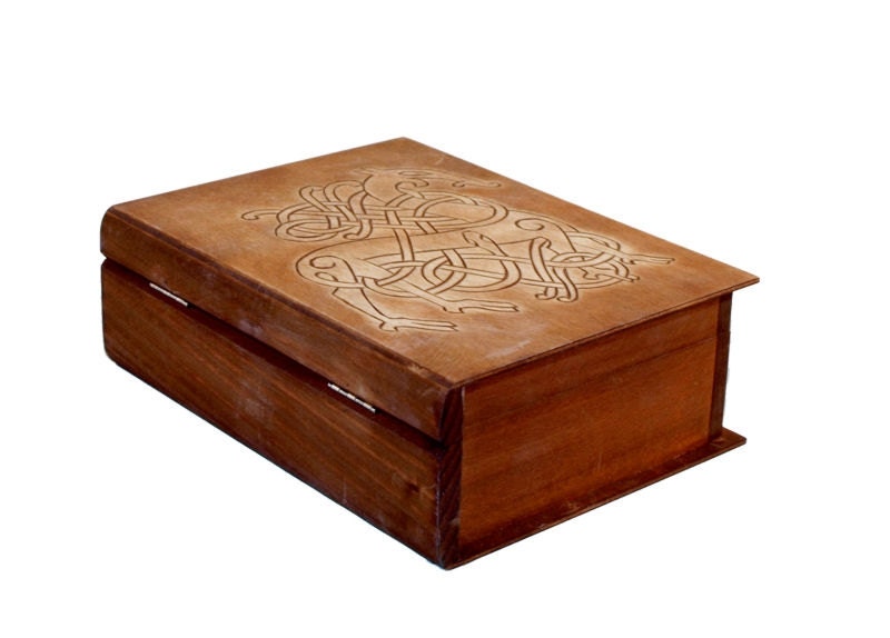 Historical wooden box in the shape of a book with Urnes Dragons
