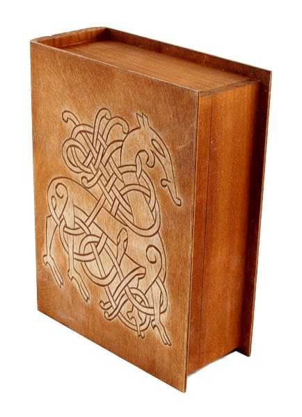 Historical wooden box in the shape of a book with Urnes Dragons