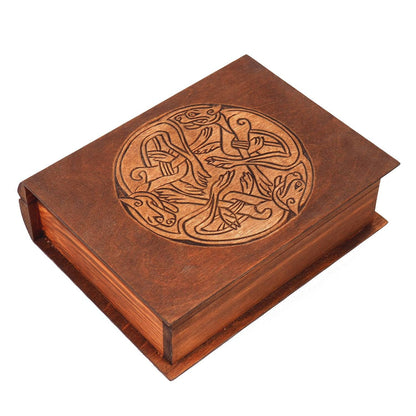 Historical wooden box in the shape of a book with  3 Dogs Book of Kells