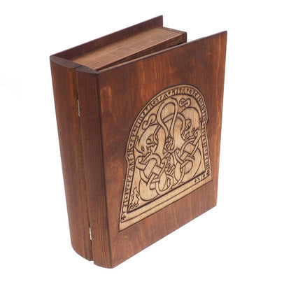 Historical wooden box in the shape of a book with  runestone