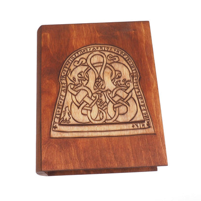 Historical wooden box in the shape of a book with  runestone