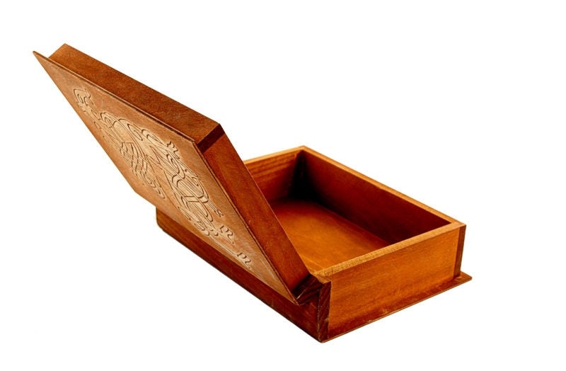 Historical wooden box in the shape of a book with Urnes Dragons