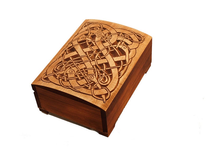 Historic wooden jewelry box featuring Urnes dragons