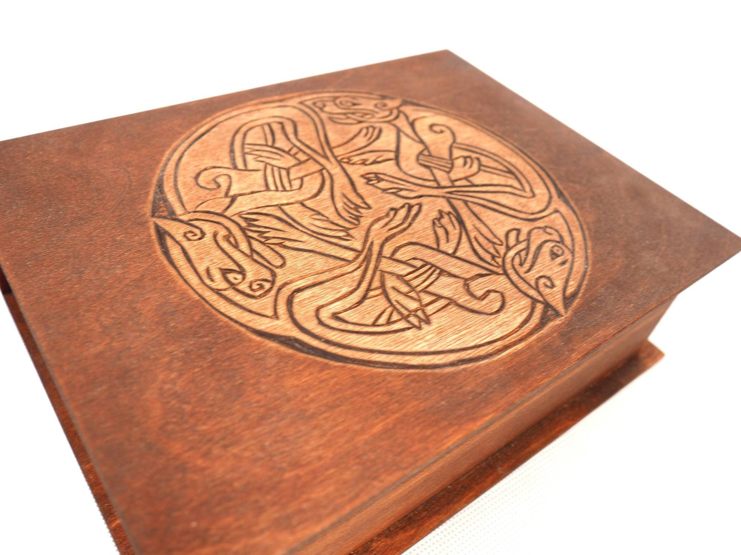 Historical wooden box in the shape of a book with  3 Dogs Book of Kells